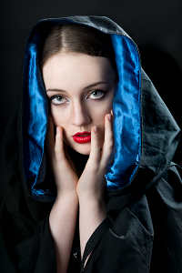 Veil of night. Leah Bell in a dramatic portrait with a dark, sculptural silhouette.