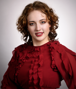 Lightness. Leah Bell in a portrait with a warm, gentle expression.