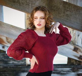 Open horizon. Leah Bell by the coast beneath Coffs Harbour Jetty, gazing toward the shoreline.