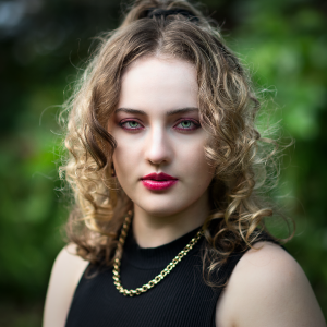 Natural frame. Leah Bell in a portrait set against a natural backdrop.