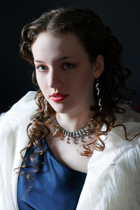 Afterglow. A theatrical portrait of Leah Bell, where shadow, form, and intensity create a sense of mystery, tension, and stage-bound presence.