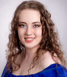 A moment of light. Leah Bell smiling in a studio portrait.