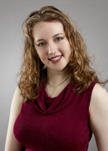 A moment of warmth. Leah Bell smiling in a studio portrait.