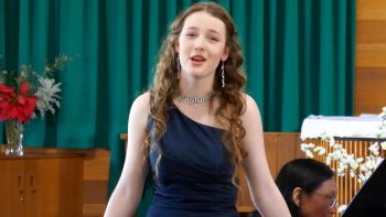 Leah Bell in performance. Leah Bell singing in a live performance.