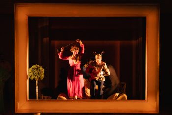 Orphée aux Enfers at NIDA; Photography by Julia Firak. Leah Bell performing in a framed stage moment in Orphée aux Enfers at NIDA.