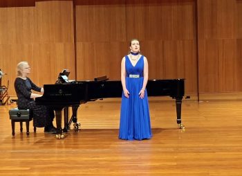 In collaboration. Leah Bell performing with a pianist.