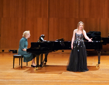 In performance. Leah Bell in a solo performance with accompanist.